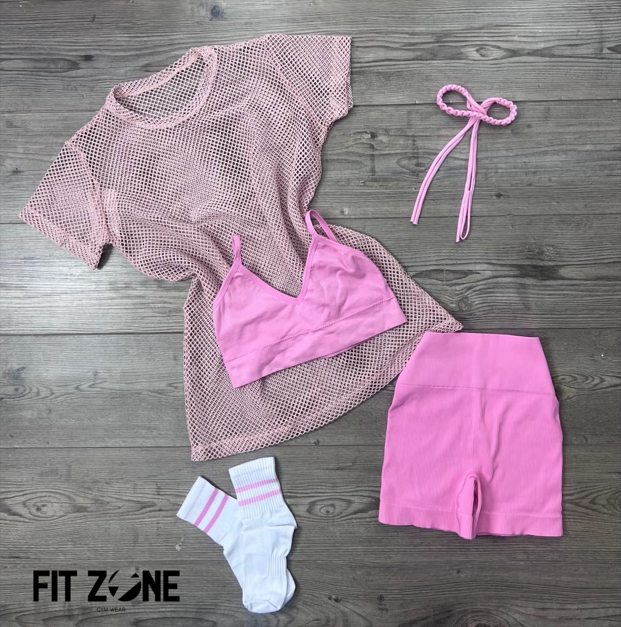 Mujer con conjunto deportivo trio rosa y café de Fit Zone, vista frontal